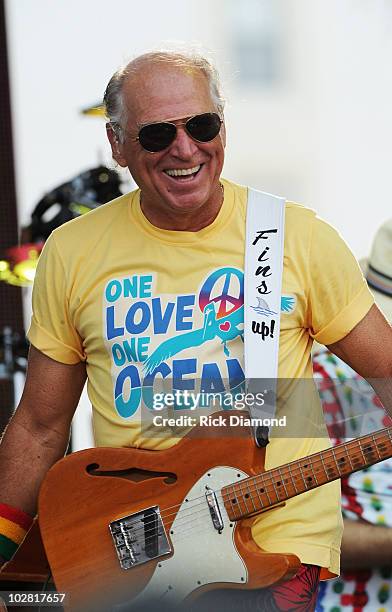 Musician Jimmy Buffett performs onstage at Jimmy Buffett & Friends: Live from the Gulf Coast, a concert presented by CMT at on the beach on July 11,...