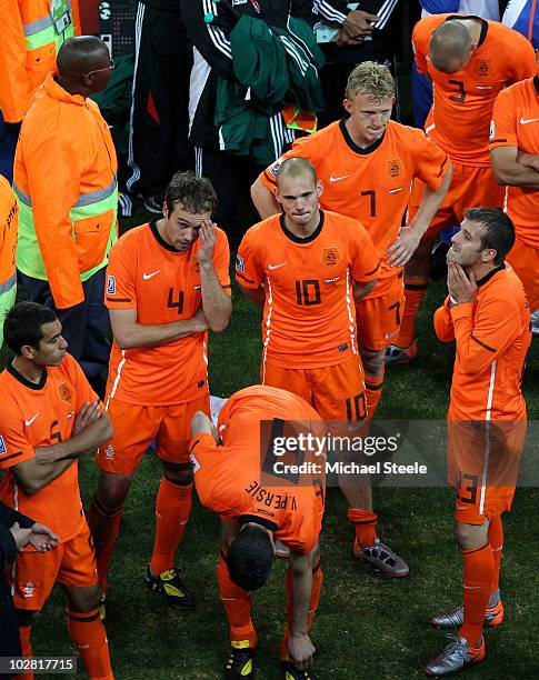 Dejected Wesley Sneijder of the Netherlands with team mates wait to collect their medals after defeat during the 2010 FIFA World Cup South Africa...