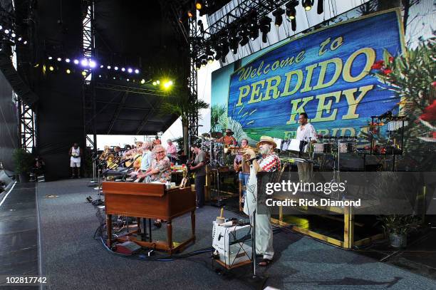 Musician Jimmy Buffett performs onstage at Jimmy Buffett & Friends: Live from the Gulf Coast, a concert presented by CMT at on the beach on July 11,...