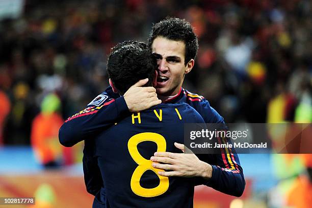 Xavi Hernandez and Francesc Fabregas of Spain celebrate winning the World Cup during the 2010 FIFA World Cup South Africa Final match between...