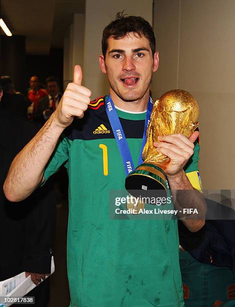 Iker Casillas of Spain celebrates in the Spanish dressing room after they won the 2010 FIFA World Cup at Soccer City Stadium on July 11, 2010 in...