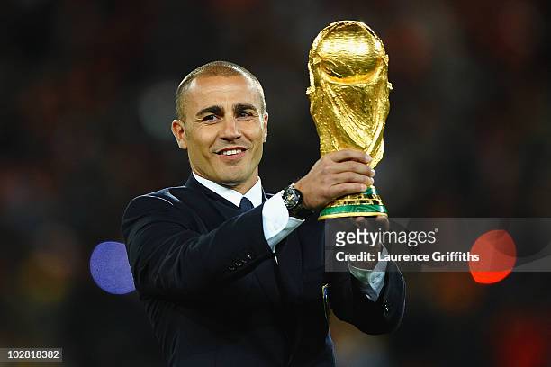 Fabio Cannavaro of Italy presents the World Cup trophy prior to the 2010 FIFA World Cup South Africa Final match between Netherlands and Spain at...