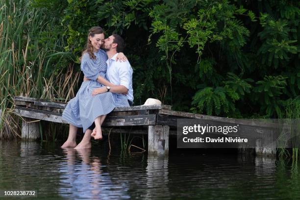 Prince Nicholas Of Romania and Princess Alina Of Romania kiss during a summer photo session in a public park on August 04, 2018 in Bucharest, Romania.