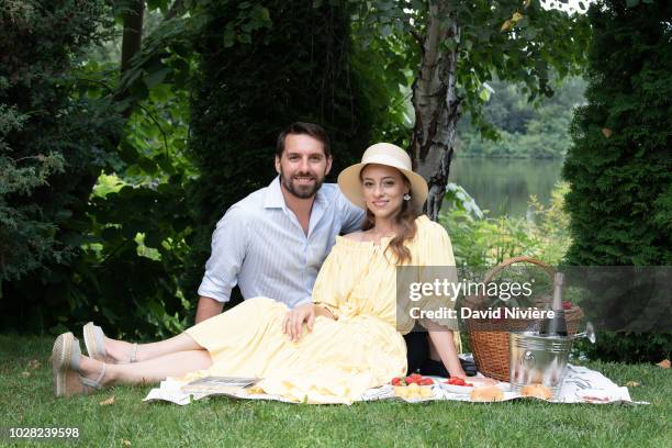 Prince Nicholas Of Romania and Princess Alina Of Romania pose during a summer photo session in a public park on August 04, 2018 in Bucharest, Romania.