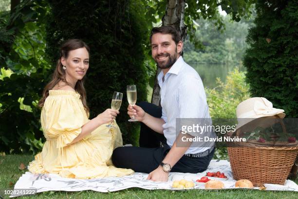 Prince Nicholas Of Romania and Princess Alina Of Romania pose during a summer photo session in a public park on August 04, 2018 in Bucharest, Romania.