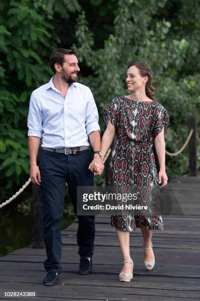 Prince Nicholas Of Romania and Princess Alina Of Romania hold hands while walking during a summer photo session in a public park on August 04, 2018...
