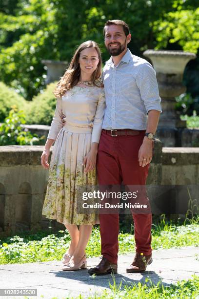 Prince Nicholas Of Romania and Princess Alina Of Romania hold hands while walking at the Peles Castle on August 05, 2018 in Sinaia, Romania.