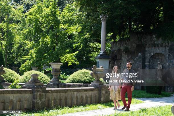 Prince Nicholas Of Romania and Princess Alina Of Romania hold their hand while walking at the Peles Castle on August 05, 2018 in Sinaia, Romania.