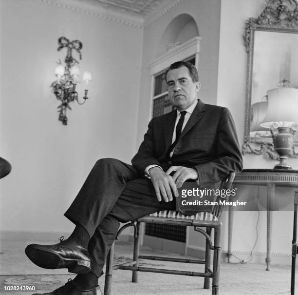 American Republican Party politician and lawyer, Richard Nixon , former Vice President of the United States, pictured seated in a room at the...