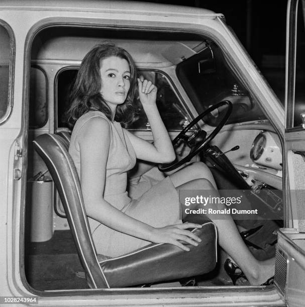 British showgirl and fashion model Christine Keeler , currently involved in the Profumo Affair, pictured seated in the driver's seat of an Austin...