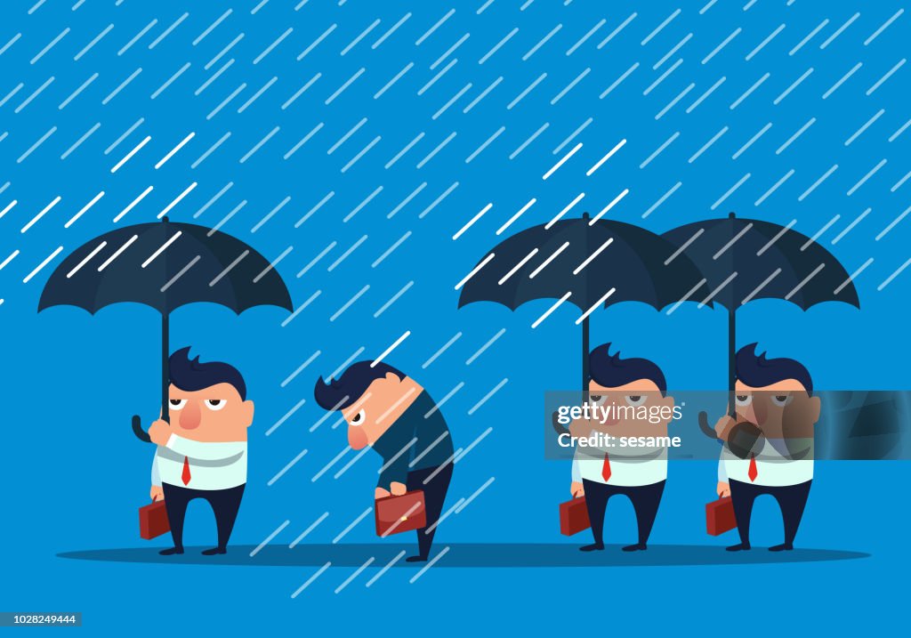 Businessman without umbrella in the rain