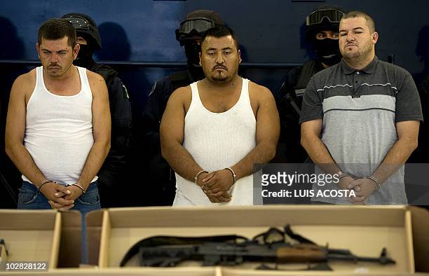 Three alleged drug traffickers, members of the Sinaloa Cartel, are presented to the press in Mexico City, on July 12 after the Mexican Federal Police...
