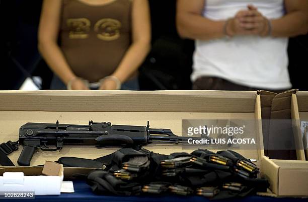 Weapons seized to members of Sinaloa Cartel are prensented during a press conference in Mexico City, on July 12 after Mexican Federal Police arrested...