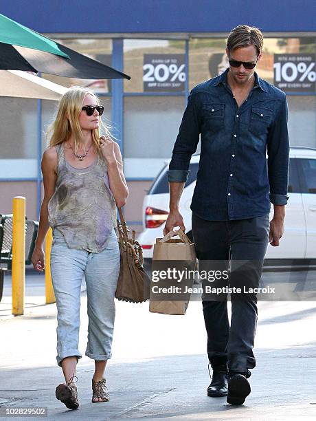 Kate Bosworth and Alexander Skarsgard shop at Bristol Farms in West Hollywood on July 11, 2010 in Los Angeles, California.