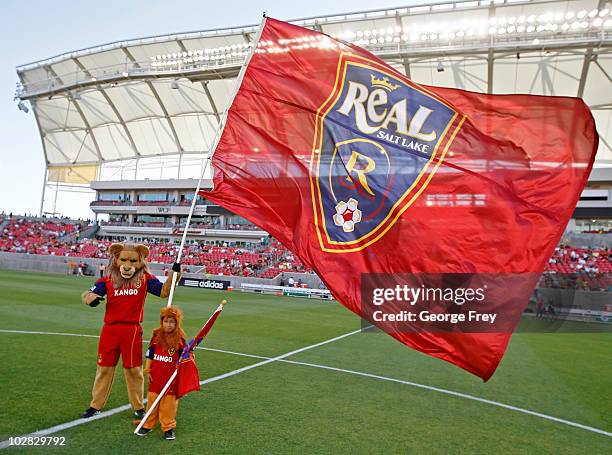 Leo, mascot of Real Salt Lake, holds the team flag before an MLS game against the New England Revolution at Rio Tinto Stadium on July 2, 2010 in...