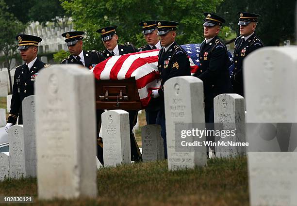 Army honor guard carries the casket of World War I casualty Private First Class Thomas D. Costello during his burial service at Arlington National...