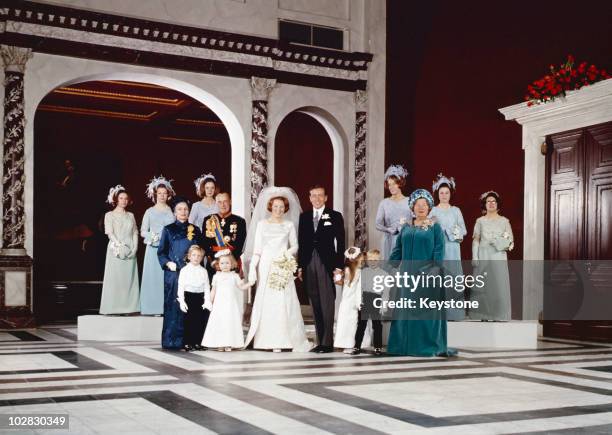 The guests pose for a portrait following the wedding of Crown Princess Beatrix of the Netherlands to Claus von Amsberg in the Town Hall in Amsterdam,...