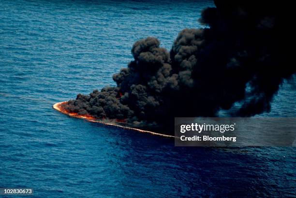 Smoke rises from a controlled burn of oil on the surface of the water near the site of the BP Plc Deepwater Horizon oil spill in the Gulf of Mexico...