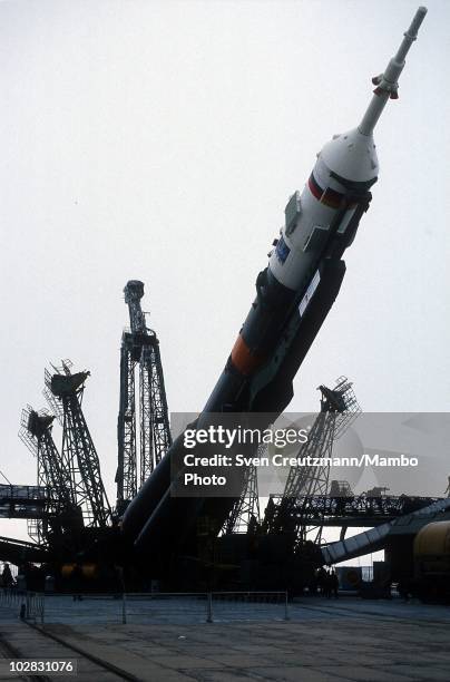 Soyuz TM-14 is being lifted into its launch position at the Baikonur Cosmodrome rocket launch ramp, on March 17 in Baikonur, Kazakhstan. The Soyuz...