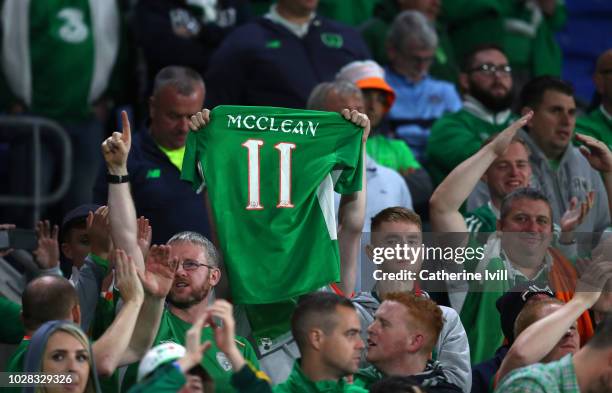 Fans hold up the shirt of James McClean of Republic of Ireland during the UEFA Nations League B group four match between Wales and Republic of...