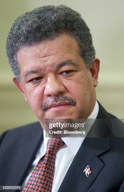 Leonel Fernandez, president of the Dominican Republic, listens as U.S. President Barack Obama speaks after a bilateral meeting in the Oval Office of...