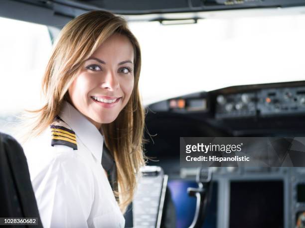 portrait of a happy pilot in the airplane's cockpit - airline pilot stock pictures, royalty-free photos & images