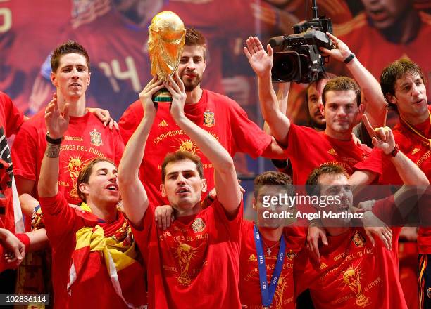 Iker Casillas of Spanish national football team holds the trophy during the Spanish team's victory parade following their victory over the...