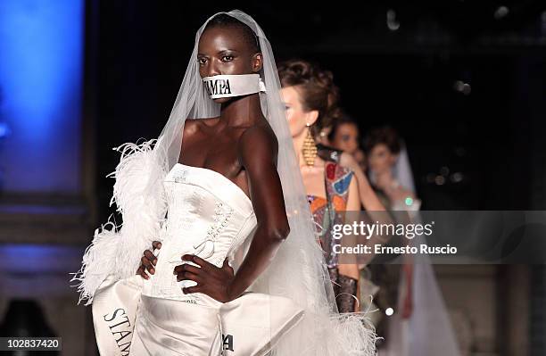 Model walks the runway during Gattinoni fashion show as part of AltaRoma AltaModa Autumn/Winter 2010 on July 12, 2010 in Rome, Italy.