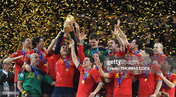 Players of Spain celebrate with the FIFA World Cup trophy after winning the 2010 World Cup football final by defeating The Netherlands during extra...