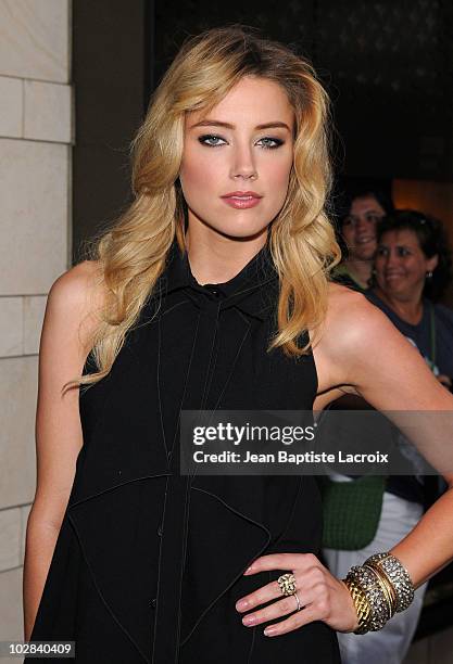 Amber Heard arrives at a cocktail party at the Louis Vuitton store on Rodeo Drive on July 13, 2010 in Beverly Hills, California.