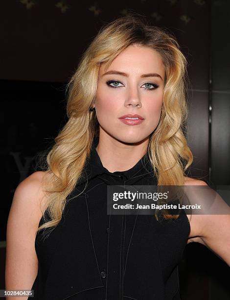 Amber Heard arrives at a cocktail party at the Louis Vuitton store on Rodeo Drive on July 13, 2010 in Beverly Hills, California.