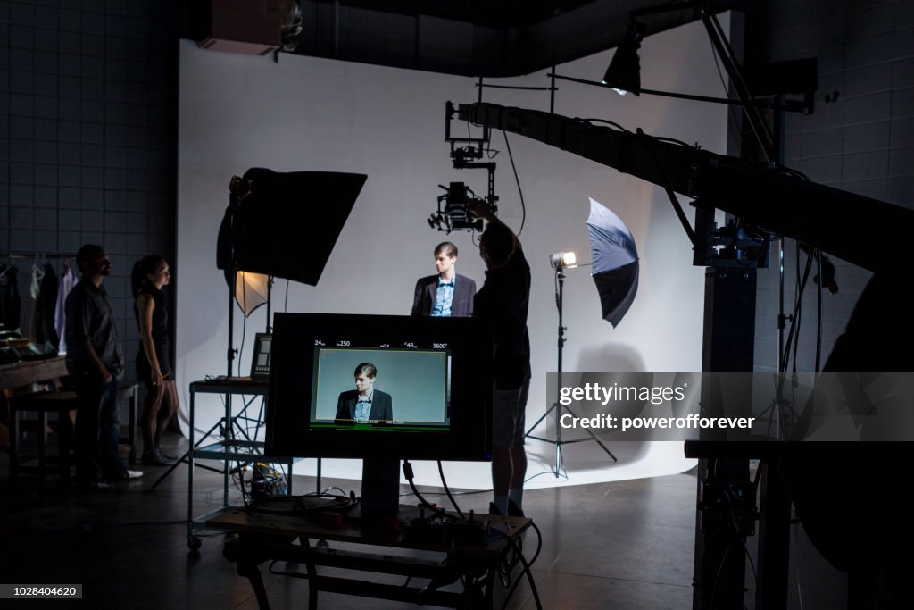 People Working Behind the Scenes on a Film Set