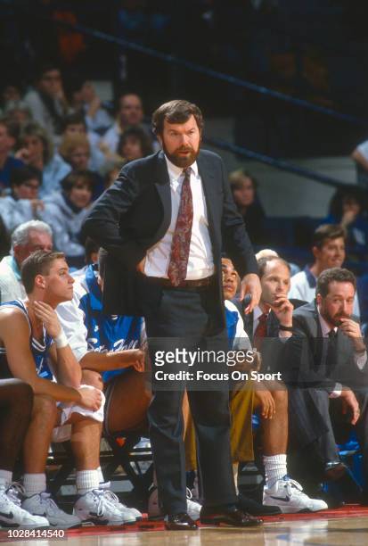 Head coach P.J. Carlesimo of the Seton Hall Pirates looks on against the Georgetown Hoyas during an NCAA College basketball game circa 1992 at the...
