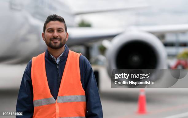 ground technician working at the airport - waistcoat stock pictures, royalty-free photos & images