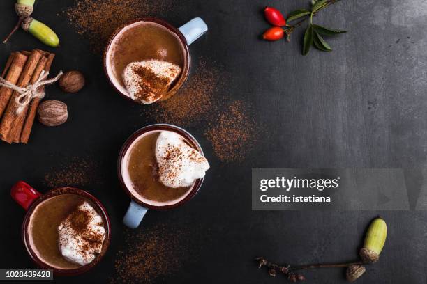 pumpkin spice latte with whipped cream - hot beverage stock-fotos und bilder