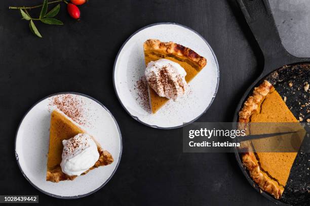 slices of pumpkin pie served on plate - postres lacteos fotografías e imágenes de stock