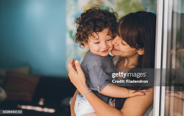 portrait of mother and son unconditional love - toddler stock pictures, royalty-free photos & images
