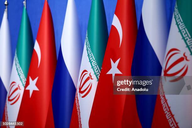 Flags of Russia, Iran and Turkey are seen during joint press conference after the trilateral summit between Turkey, Iran and Russia on September 7,...