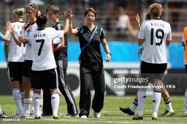 Head coach Maren Meinert of Germany celebrates with her team after winning the FIFA U20 Women's World Cup Group A match between Germany and Costa...