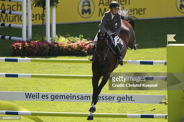 Meredith Michaels-Beerbaum of Germany rides on Checkmate and won the third place during the Stawag prize competition of the CHIO on July 13, 2010 in...