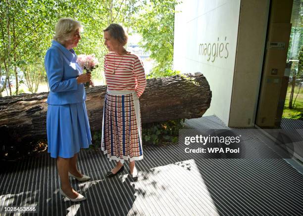 Camilla, Duchess of Rothesay speaks with Kirsty Wark, patron of Maggie's Centre during a visit to Maggie's Centre at Gartnavel Hospital on September...