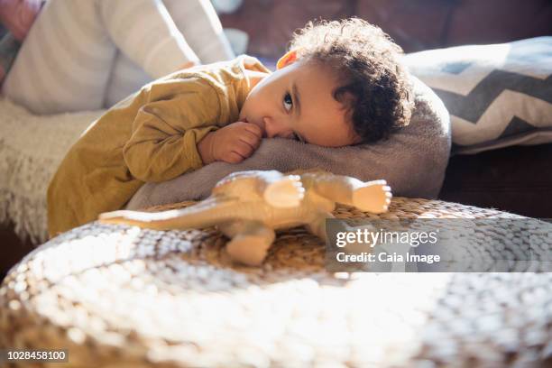 tired, cute baby boy sucking thumb - thumb sucking stock pictures, royalty-free photos & images