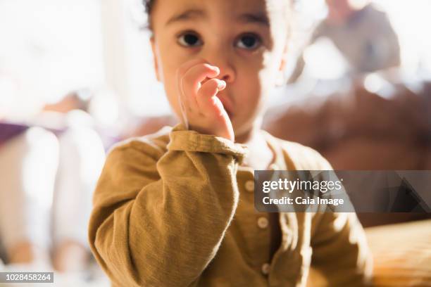 close up innocent baby boy sucking thumb - thumb sucking stock pictures, royalty-free photos & images