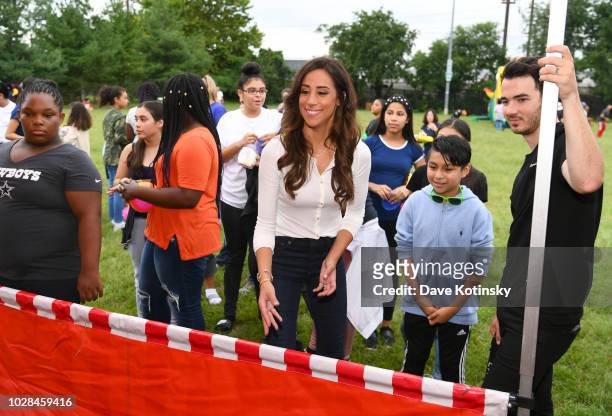 Social Influencer Danielle Jonas and recording artist Kevin Jonas enjoy activities as she attends as Vera Bradley partners with Blessings In A...