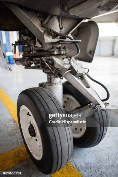 close-up on the landing gear of an airplane - landing gear stock pictures, royalty-free photos & images