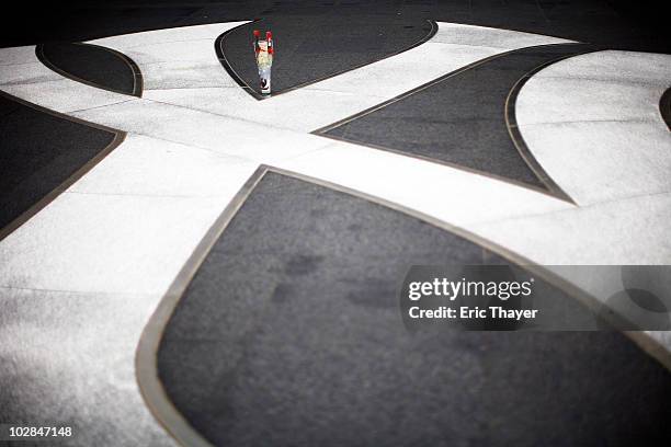 Candle and two roses sit in front of Gate 4 at Yankee Stadium, after the death of George Steinbrenner July 13, 2010 in the Bronx borough of New York...