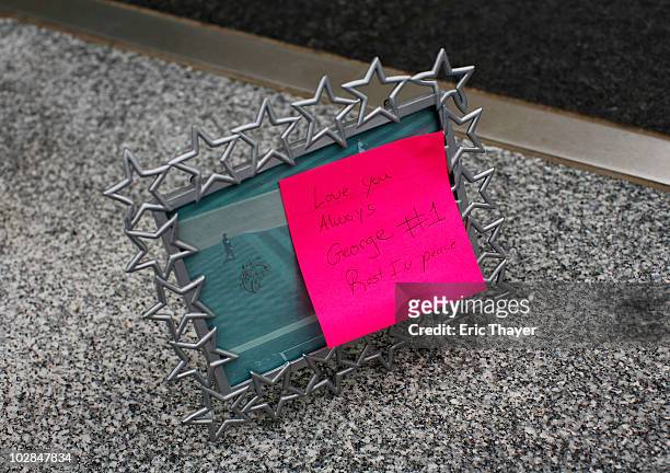 Frame with a post-it note attached sits in front of at Gate 4 of Yankee Stadium, after the death of George Steinbrenner July 13, 2010 in the Bronx...