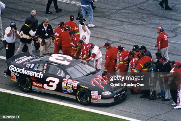 Crew members along pit road congratulate Dale Earnhardt following his victory in the Daytona 500 at Daytona International Speedway.