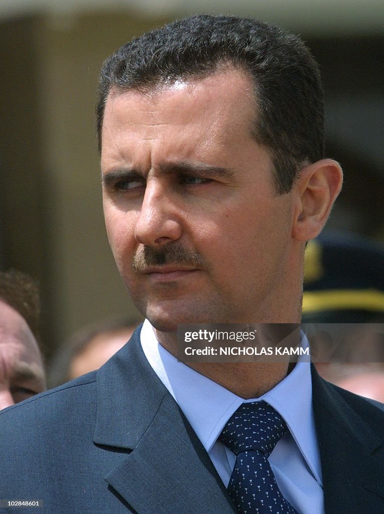 Syrian President Bashar al-Assad attends