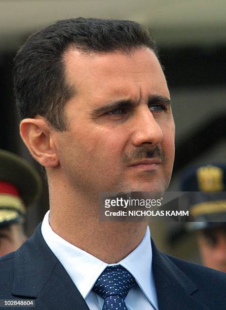 Syrian President Bashar al-Assad attends the departing ceremony of Pope John Paul II at Damascus airport 08 May 2001 at the end of the pontiff's...